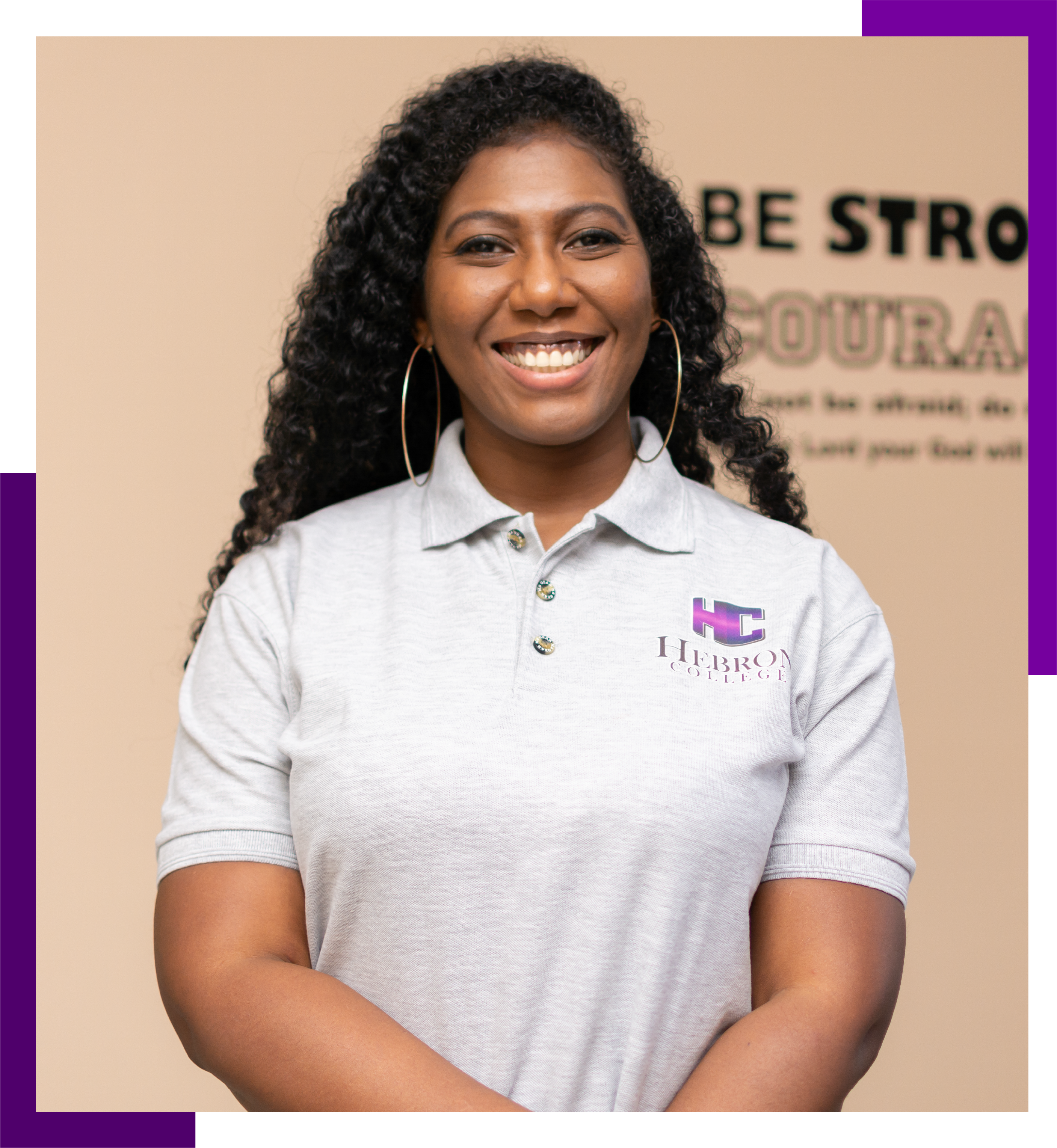 Image of Hebron College Founder, Danielle Joseph-Hughes, standing in front of a tan background